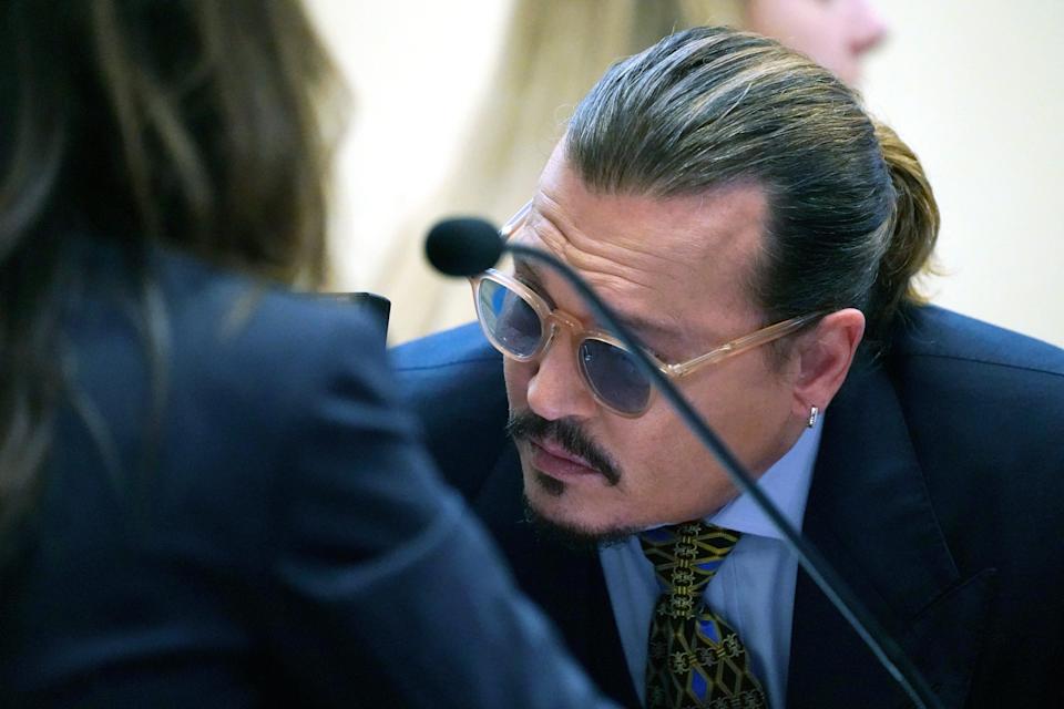 Johnny Depp testifies in the courtroom in the Fairfax County Circuit Courthouse in Fairfax, Va., Wednesday, May 25, 2022.