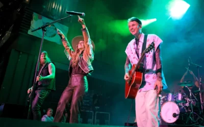 Watch MGK’s Surprise Performance Of “Lonely Road” With Lainey Wilson At The Nashville Show